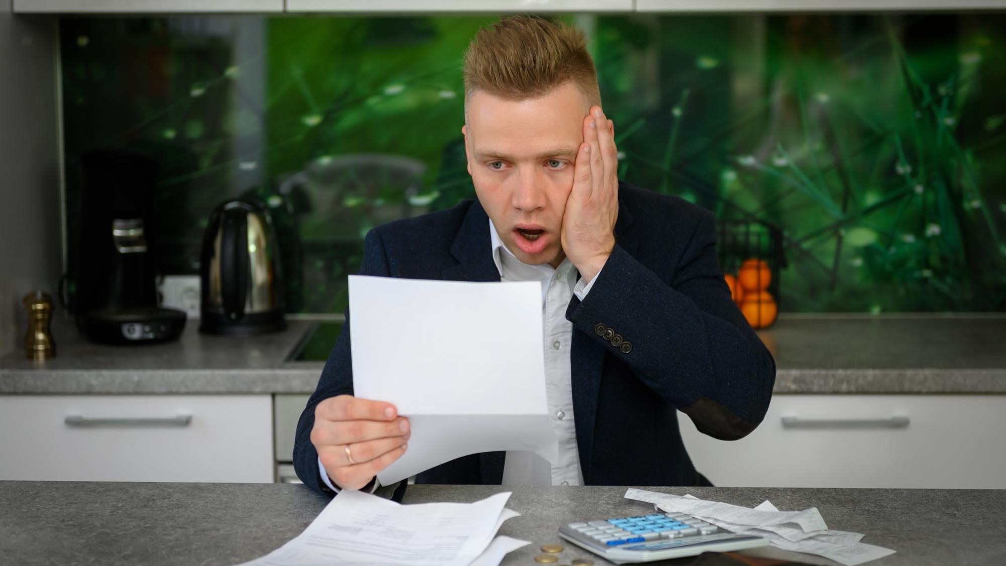 Man in shock regarding his monthly bills and finances