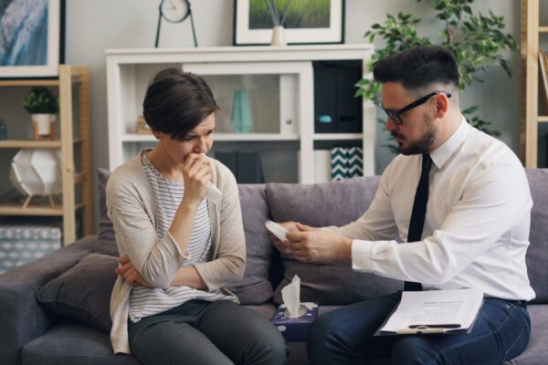 a man and a woman sitting on a couch
