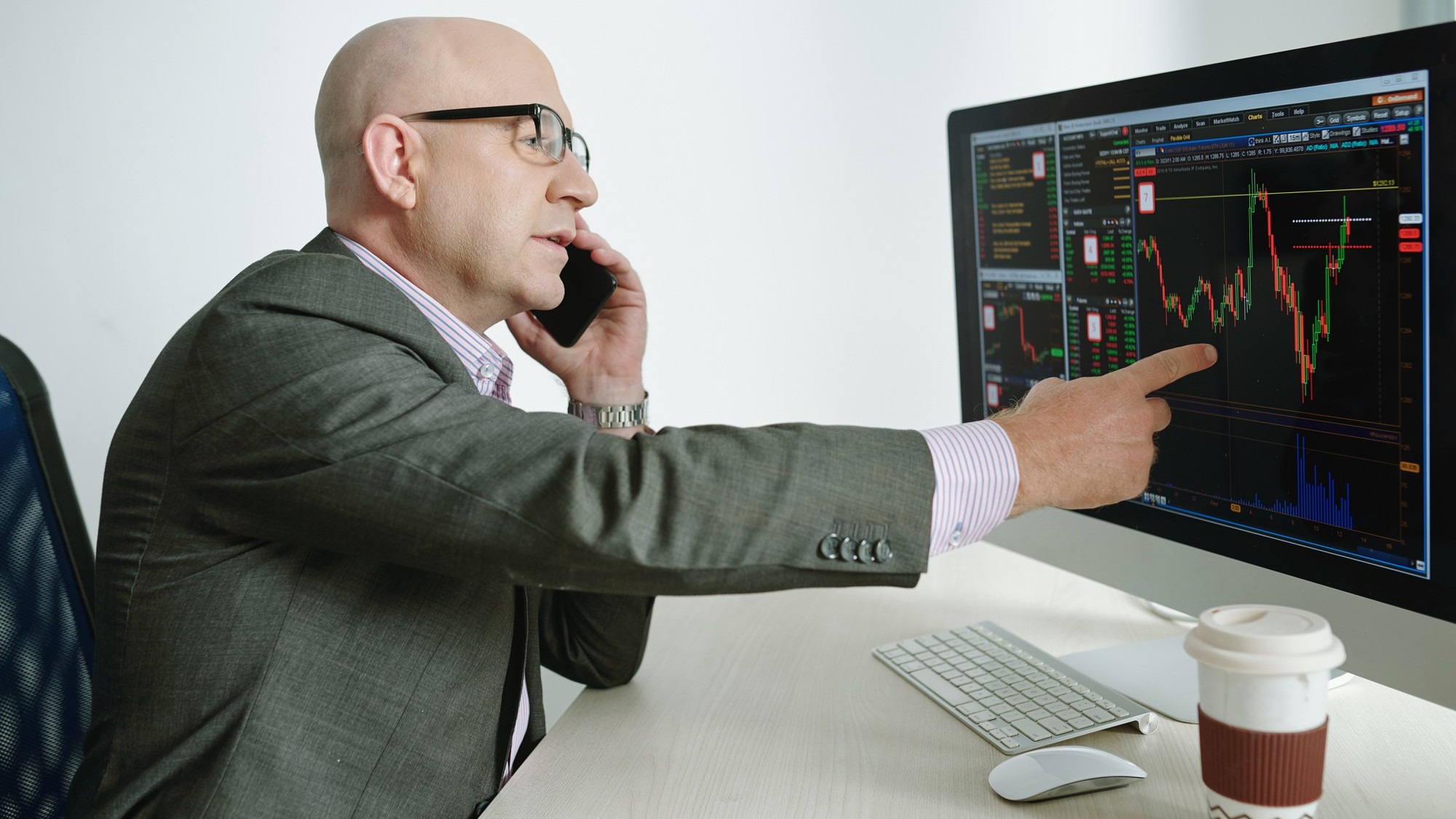 Analyst working with financial graphics