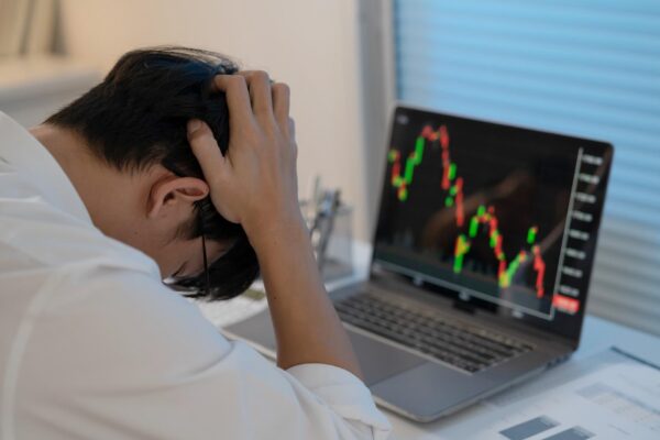 Asian businessman In the Data Mining Center Statistician with Monitors Displaying business finance technology and investment Stock Market Investments