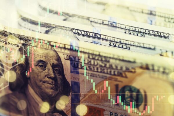 United States dollars Pile of hundred USD banknotes Green toned photo with selective focus