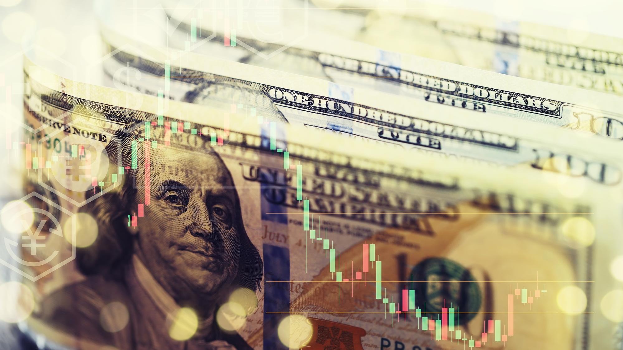 United States dollars Pile of hundred USD banknotes Green toned photo with selective focus