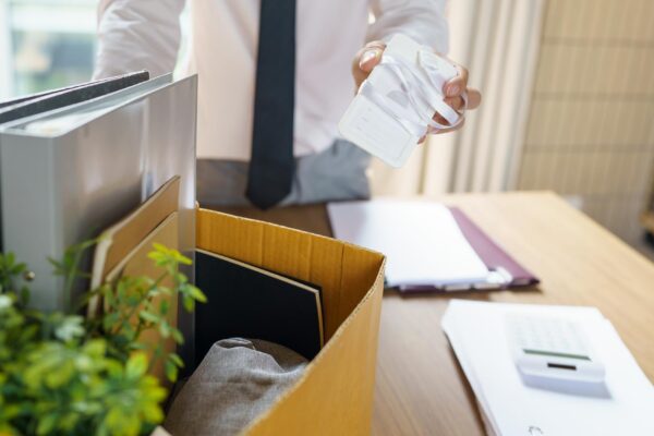 Quit Job Business man sending resignation letter and packing Stuff Resign Depress or carrying business cardboard box in office Change of job or fired from company