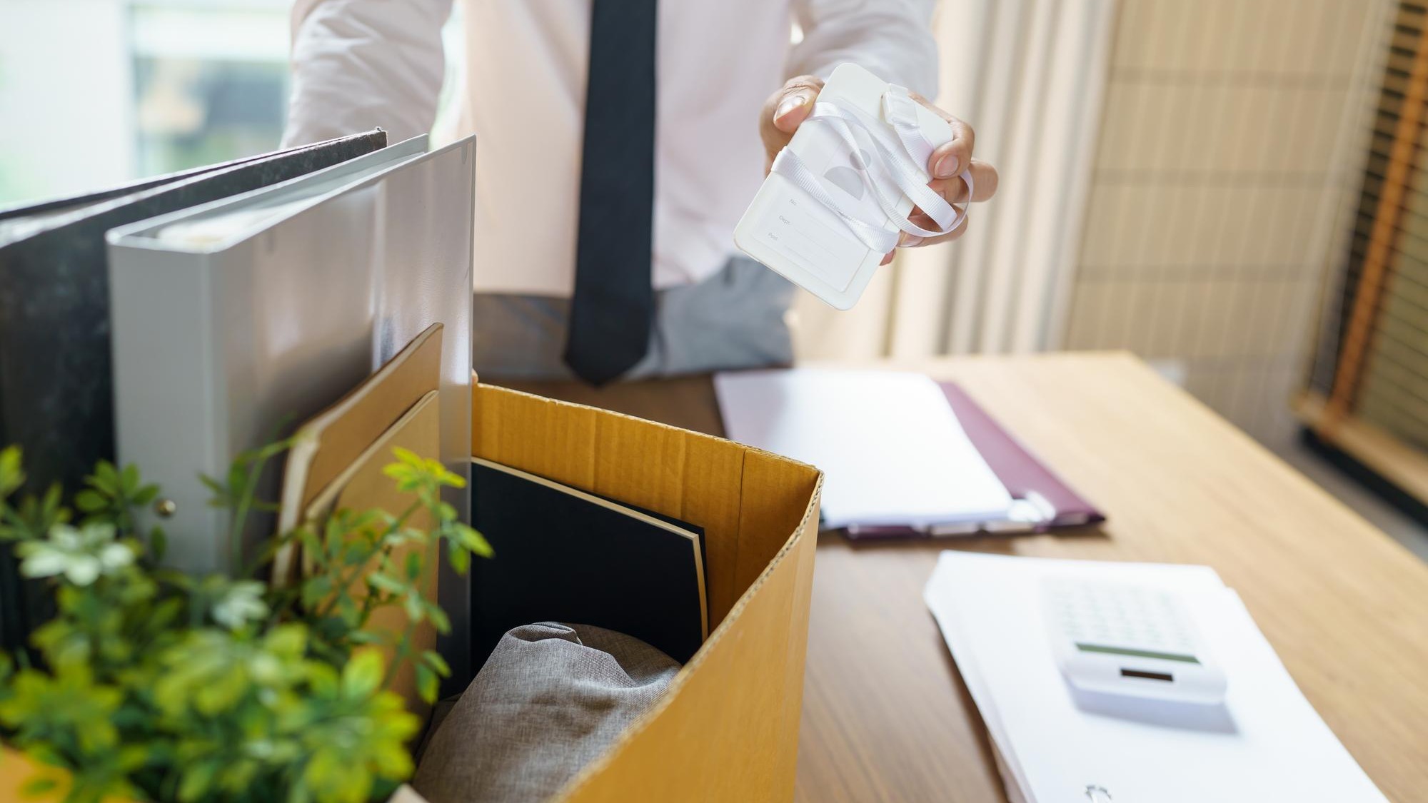 Quit Job Business man sending resignation letter and packing Stuff Resign Depress or carrying business cardboard box in office Change of job or fired from company