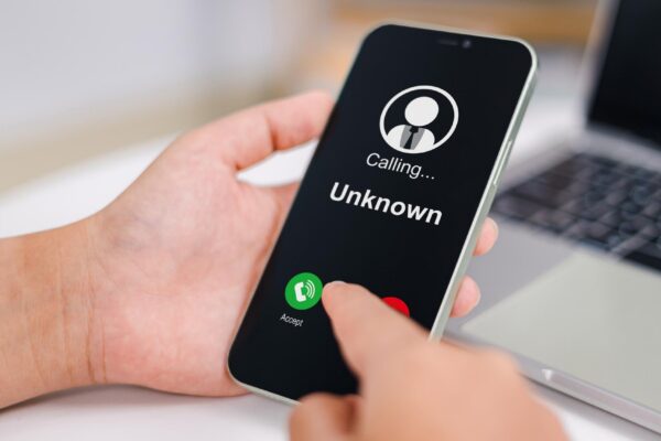 Woman receives a phone call from an unknown number Concept of scammers or strangers fraud and contact to sell mobile internet promotions spam fake identity scammer scam with mobile phone