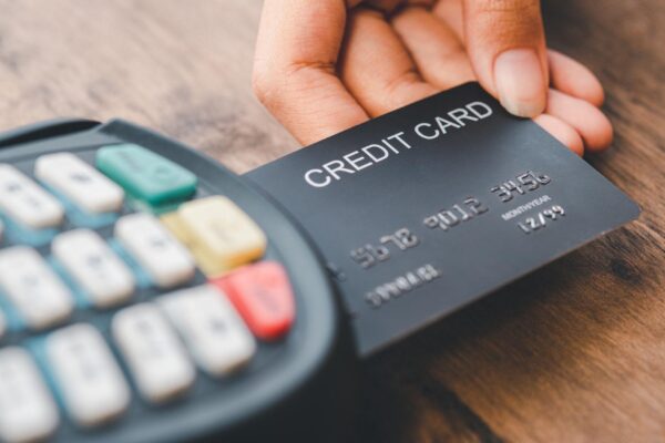 Paying by credit card , buying and selling products using a credit card swipe machine