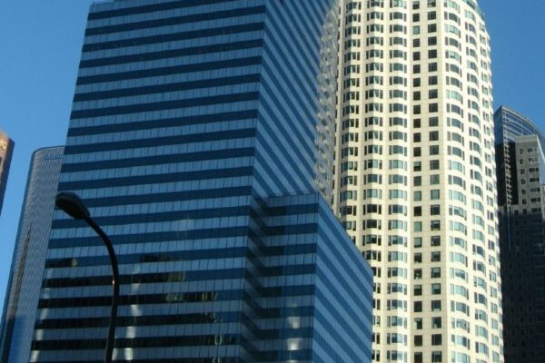 US Bank Tower, formerly Library Tower and First Interstate Bank World Center, is a 1,018-foot (310 m) skyscraper at 633 West Fifth Street in downtown Los Angeles, California. It is the tallest building in California, the tenth tallest in the United States, the tallest west of the Mississippi River, and the 63rd tallest building in the world. Because local building codes require all high-rise buildings to have a helipad, it was known as the tallest building in the world with a roof-top heliport from its completion in 1989 to 2004 when Taipei 101 opened. It is also the second tallest building in a major active seismic region; its structure was designed to resist an earthquake of 8.3 on the Richter scale. It consists of 73 stories above ground and two parking levels below ground. Construction began in 1987 with completion in 1989. The building was designed by Henry N. Cobb of the architectural firm Pei Cobb Freed & Partners and cost $350 million to build. It is one of the most recognizable buildings in Los Angeles, often used in establishing shots for the city in films and television programs. en.wikipedia.org/wiki/U.S._Bank_Tower_(Los_Angeles) en.wikipedia.org/wiki/Wikipedia:Text_of_Creative_Commons_...