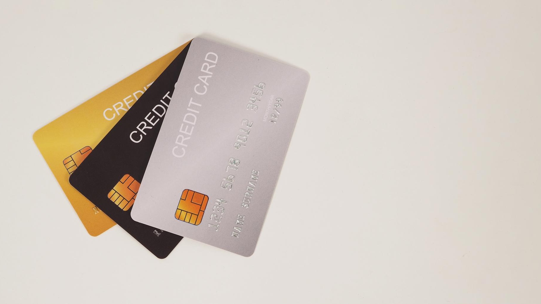 Three credit cards on white backgroundx9