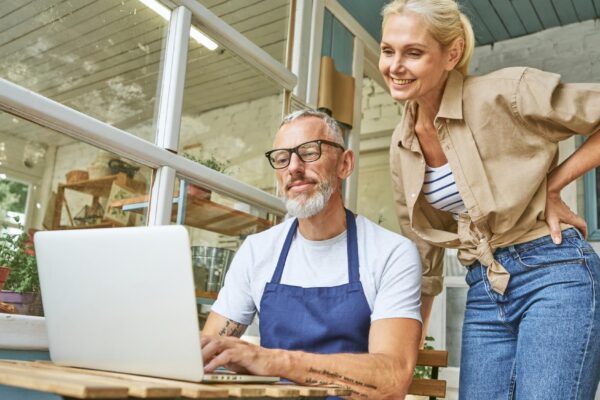Middle aged caucasian business partners working on laptop