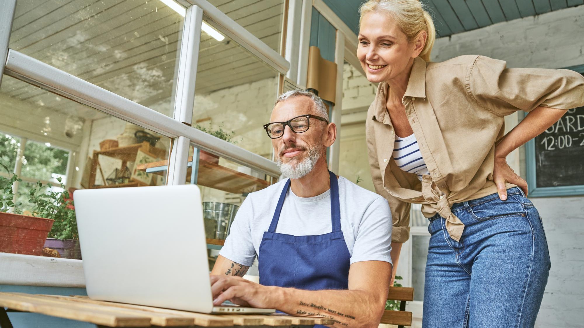 Middle aged caucasian business partners working on laptop