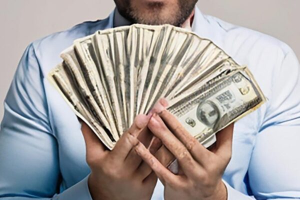 A man with a lot of money in his hands