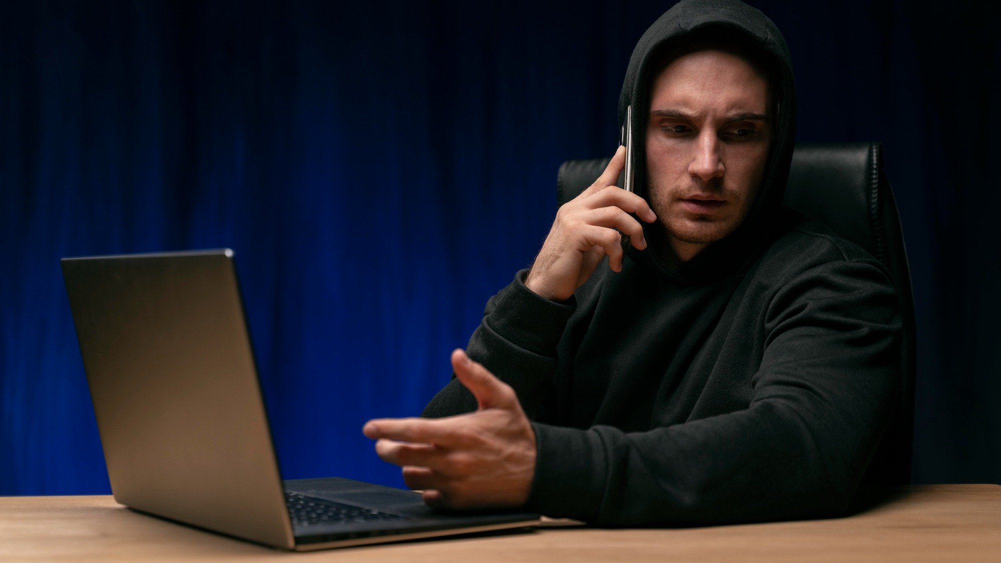 Medium shot programmer talking on phone