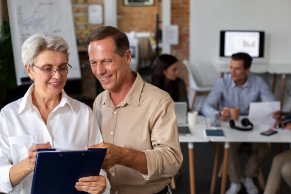 Close up on smiling person in conference room