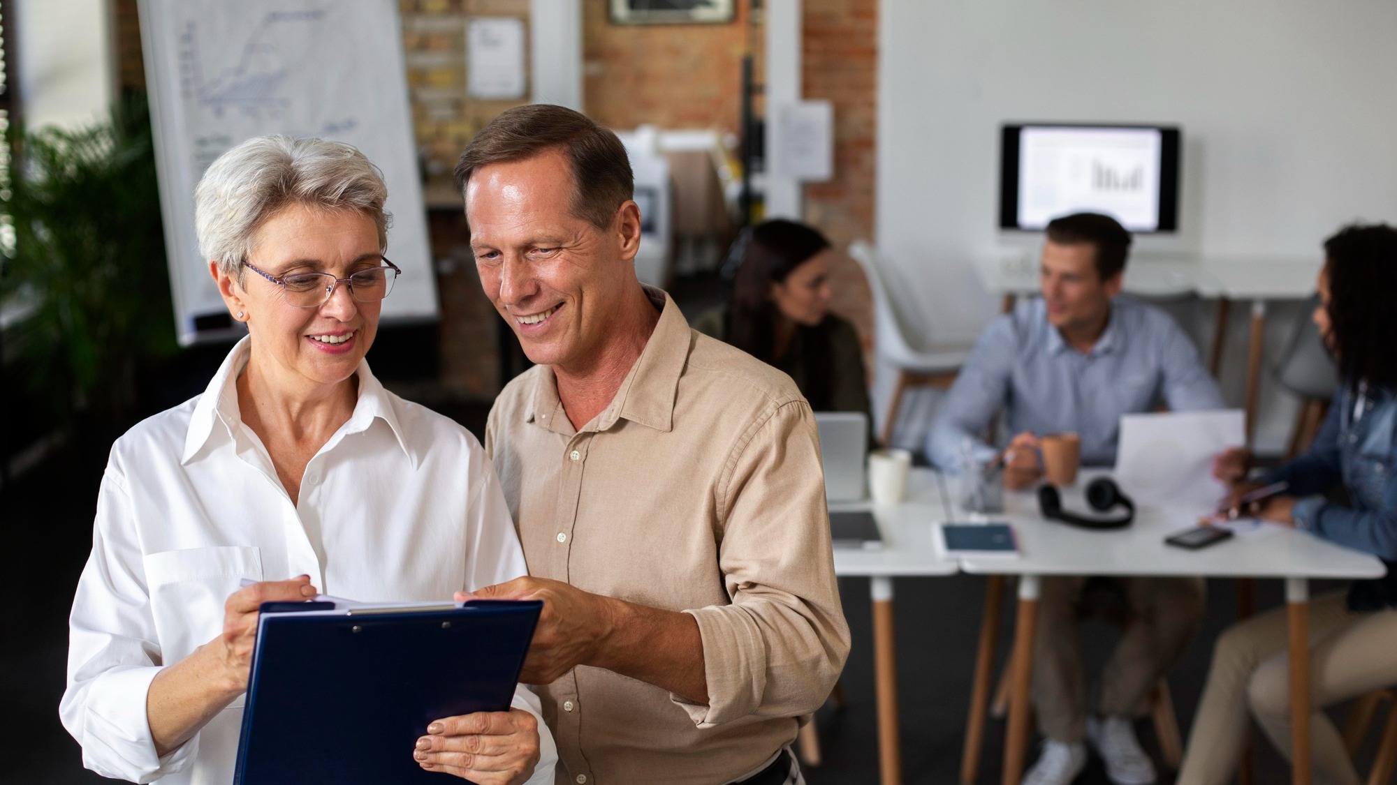 Close up on smiling person in conference room