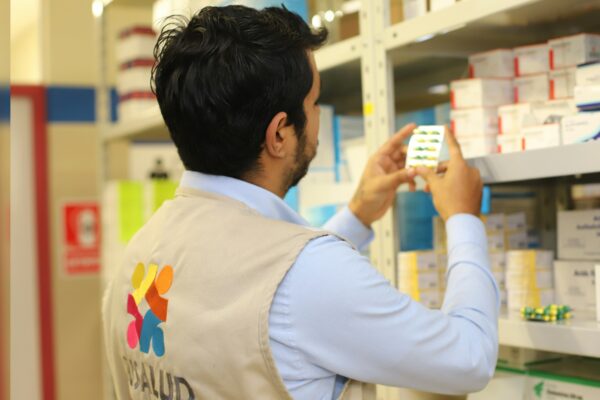 a man taking a picture of a product in a store