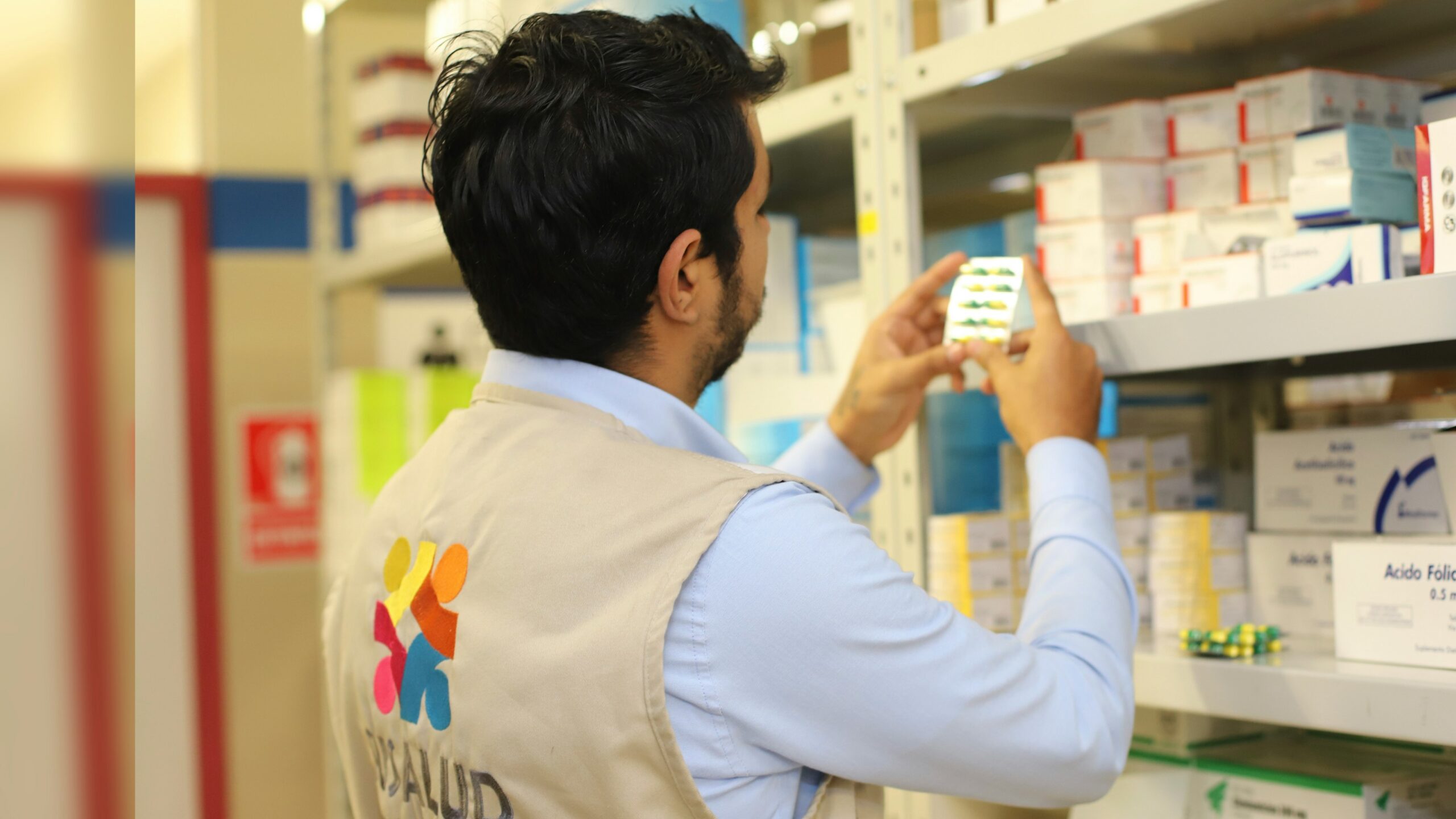 a man taking a picture of a product in a store