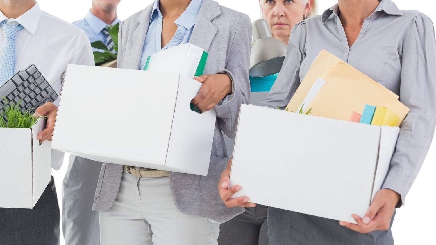 Employees carrying boxes after job loss