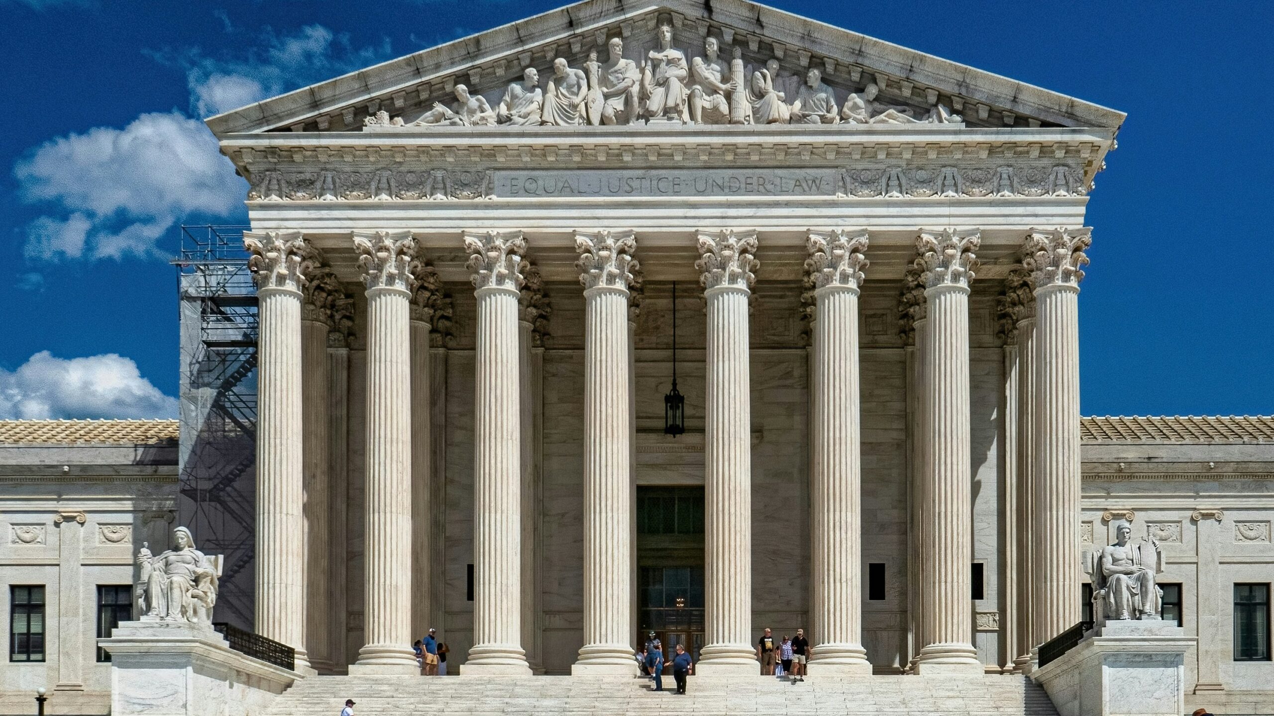 a group of people standing in front of a building