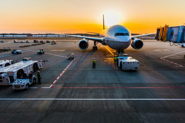 gray airplane on parking
