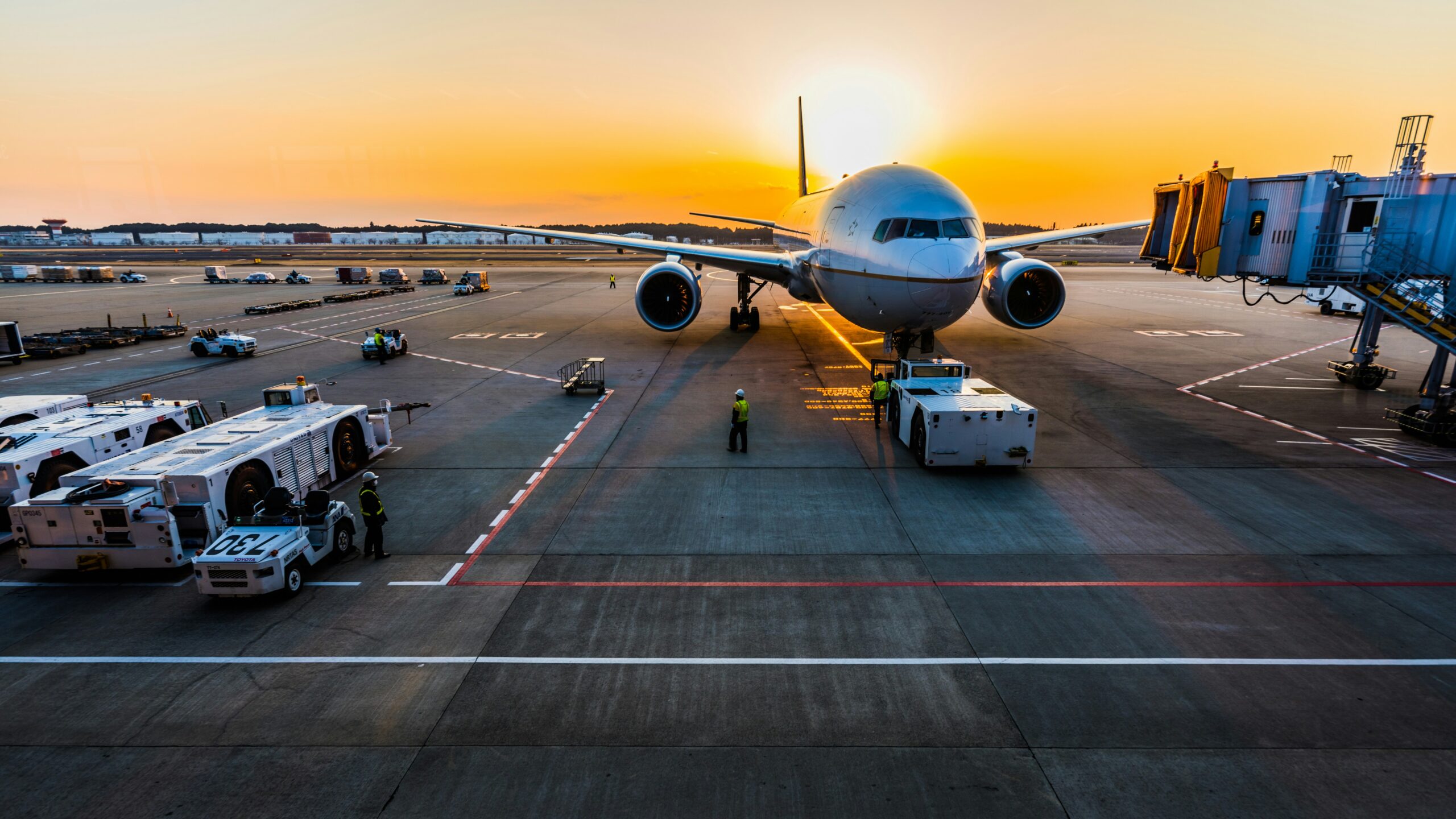 gray airplane on parking
