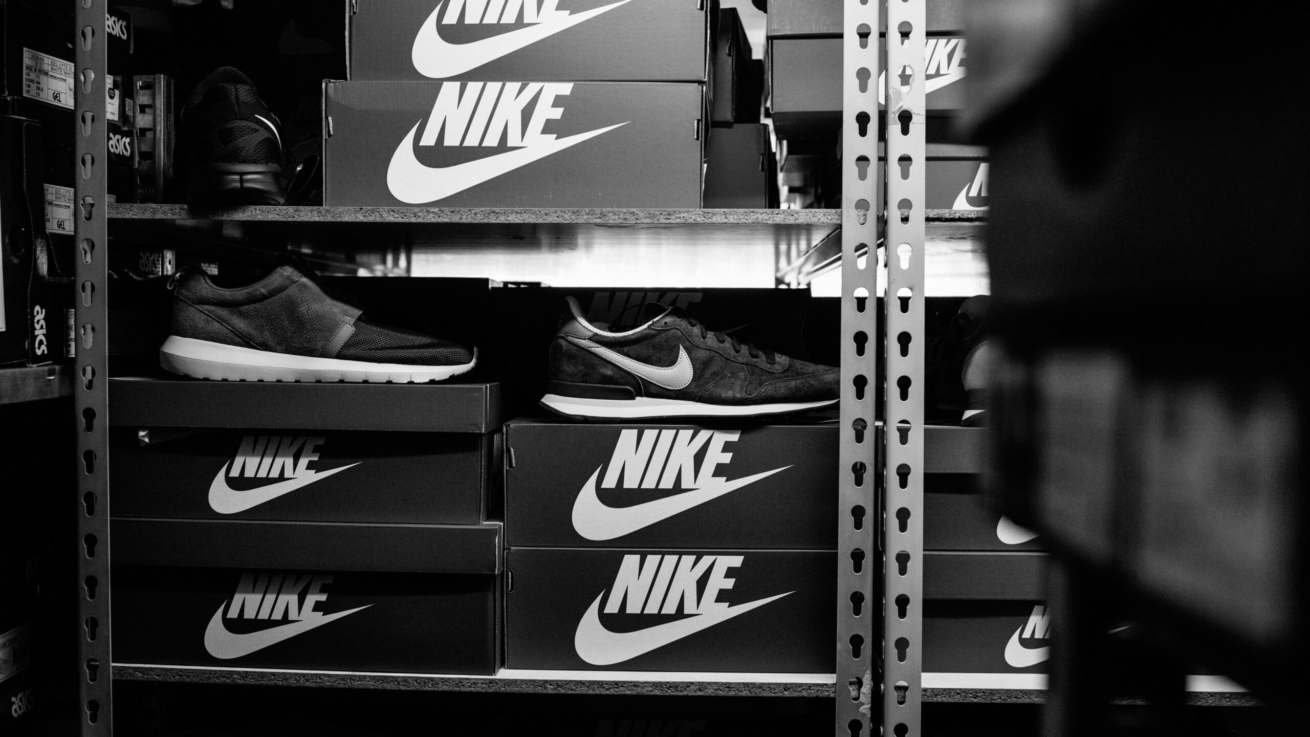 a black and white photo of a pair of nike shoes
