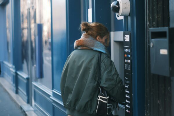 Woman using an atm on a city street