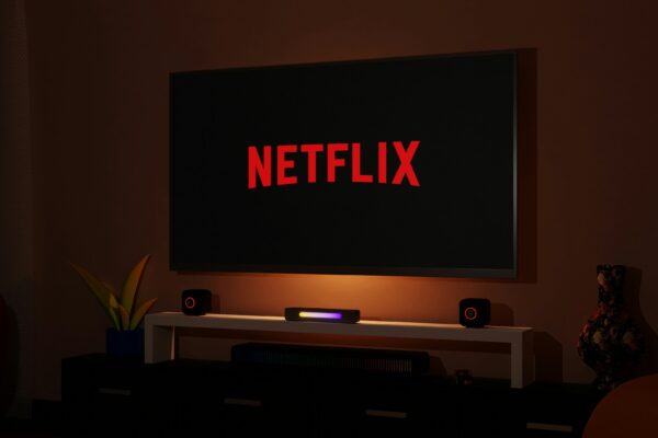 a flat screen tv sitting on top of a entertainment center