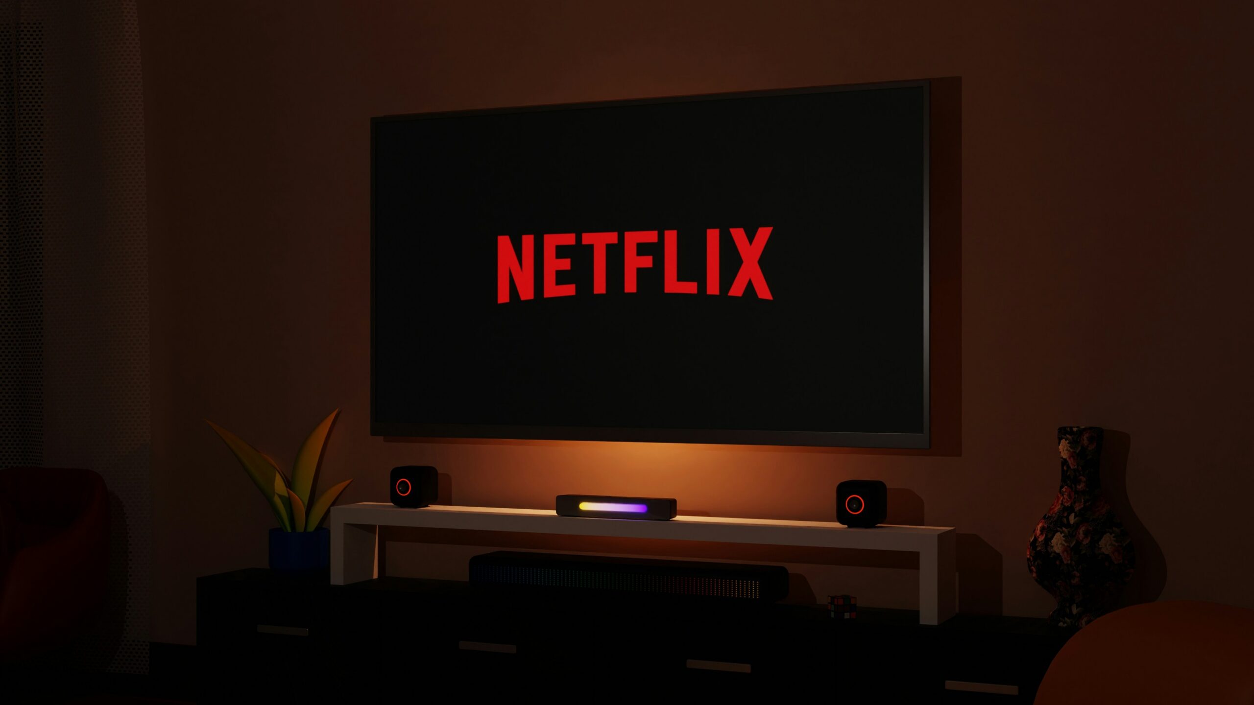 a flat screen tv sitting on top of a entertainment center