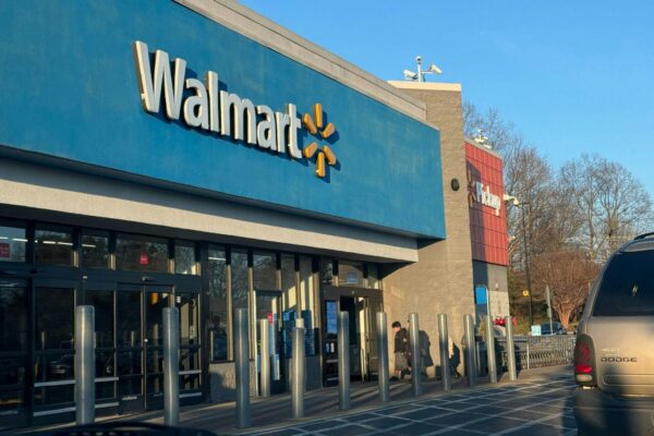 a walmart store with a car parked in front of it