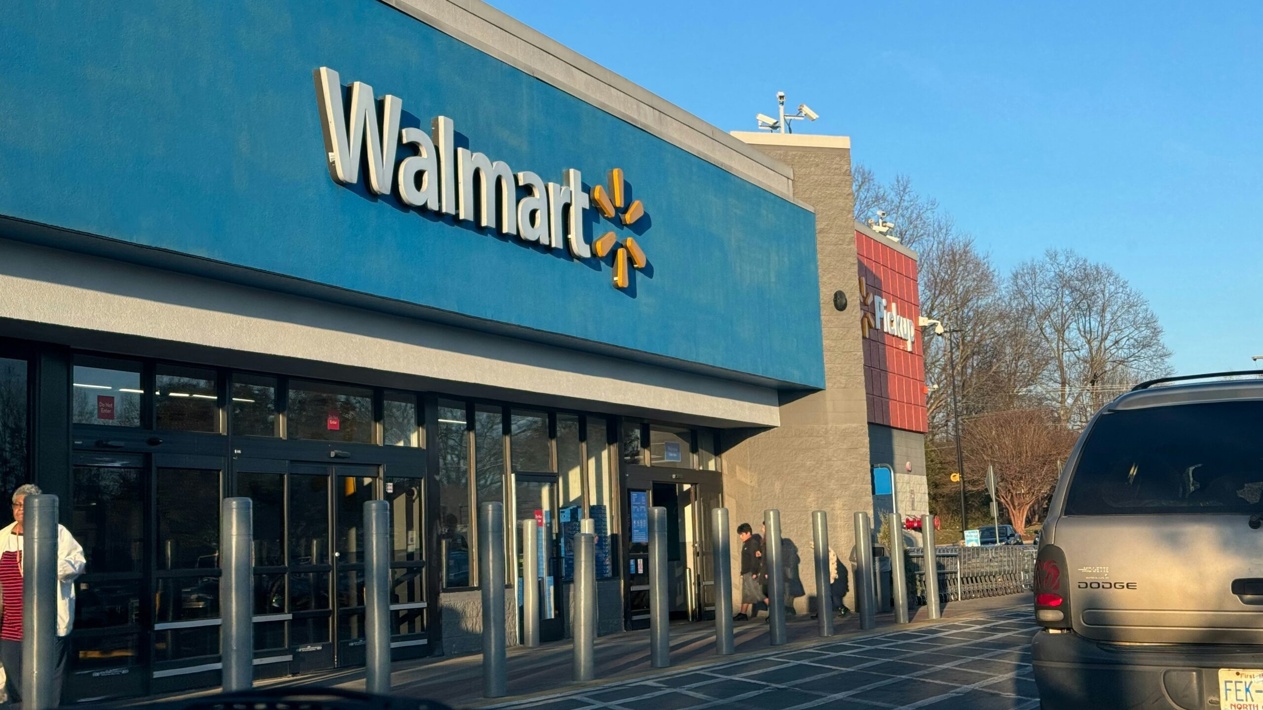 a walmart store with a car parked in front of it