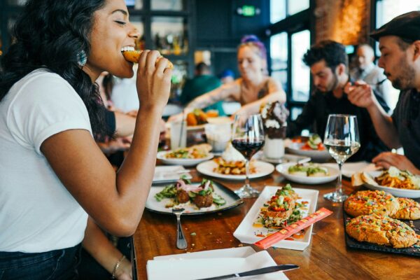 woman in white shirt eating