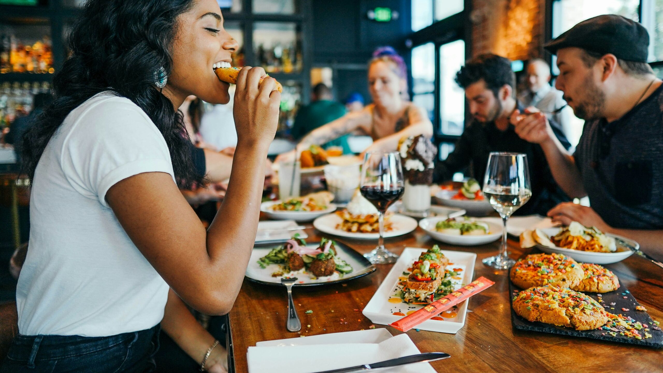 woman in white shirt eating