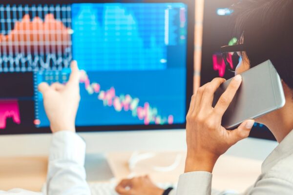 Business Team trading stocks online Investment discussing and analysis graph stock market