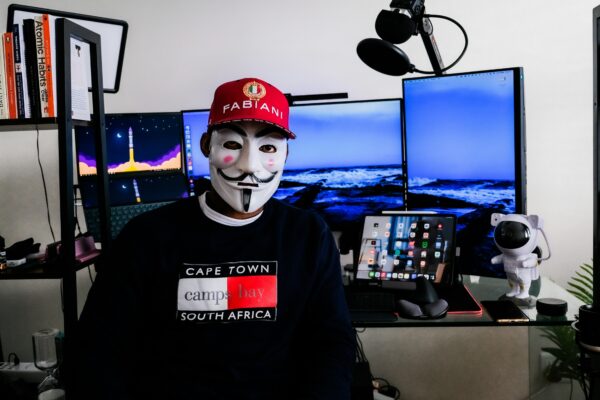 a person wearing a mask and a red hat