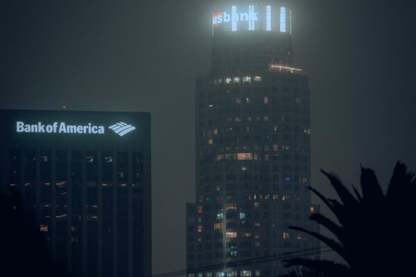 the bank of america building is lit up at night