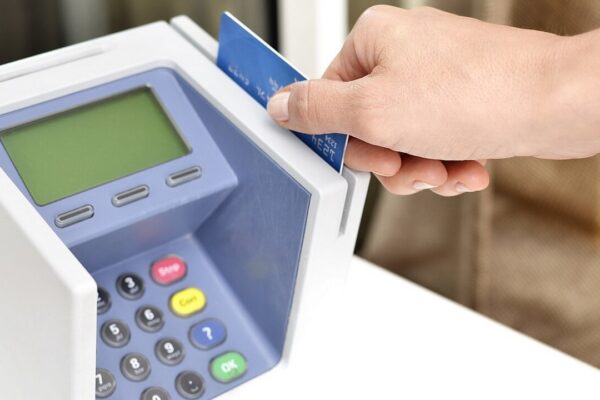 This photo shows a female hand sliding a debit or credit card through a blue point-of-sale machine. She could be making a retail purchase, or it could be a clerk or server processing payment at a store or restaurant. This picture would be good for illustrating purchases, business transactions, consumer buying habits, or purchasing convenience. Feel free to use them but please credit our website as the source, for example: Image: Hloom via Flickr / CC BY-SA, 401(K) 2013 Please add link to this image for "flickr", and link to our homepage hloom.com for "hloom"