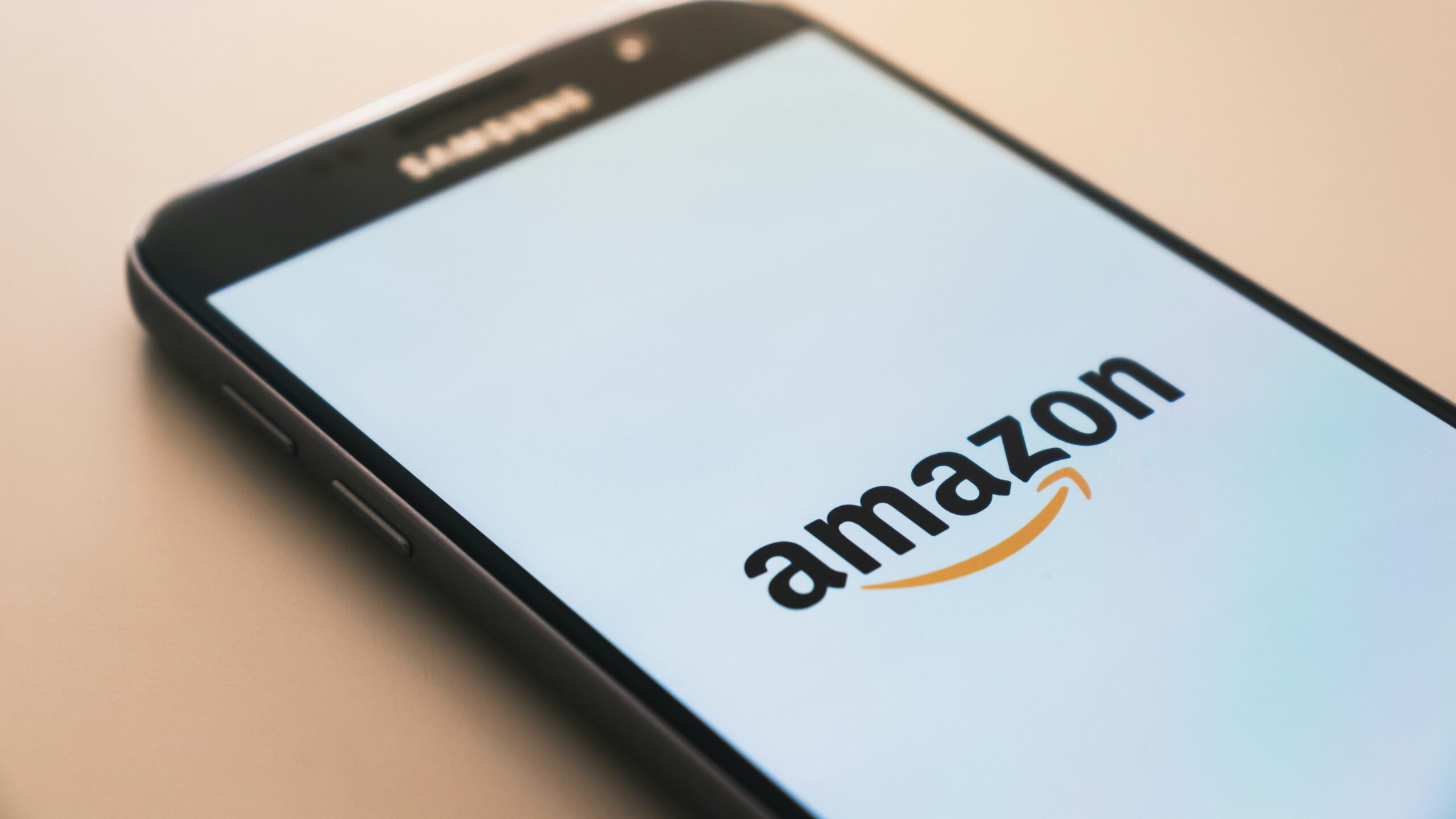black Samsung Galaxy smartphone displaying Amazon logo