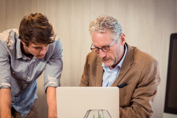 Businessmen working on laptop
