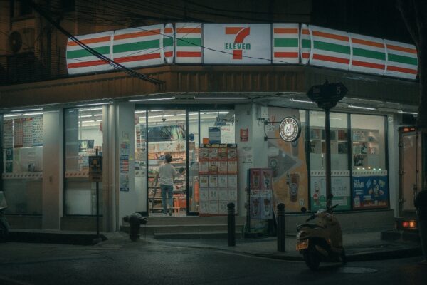 a motorcycle parked in front of a store at night
