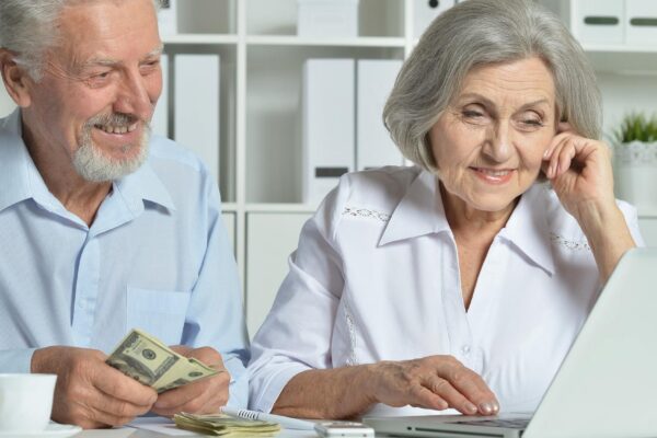 Portrait of an elderly couple with a laptop