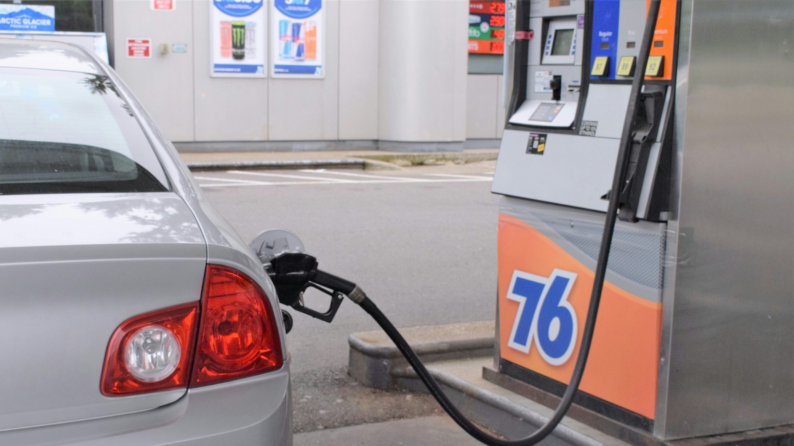 a car is parked at a gas pump