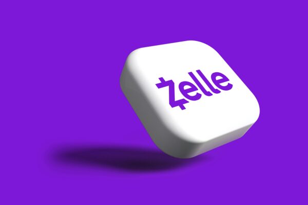 a white dice with the word zelle on it
