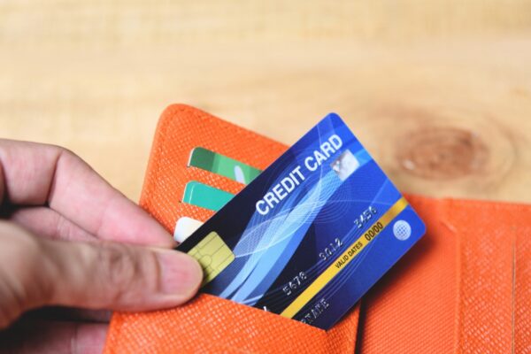 Credit card in wallet with hand