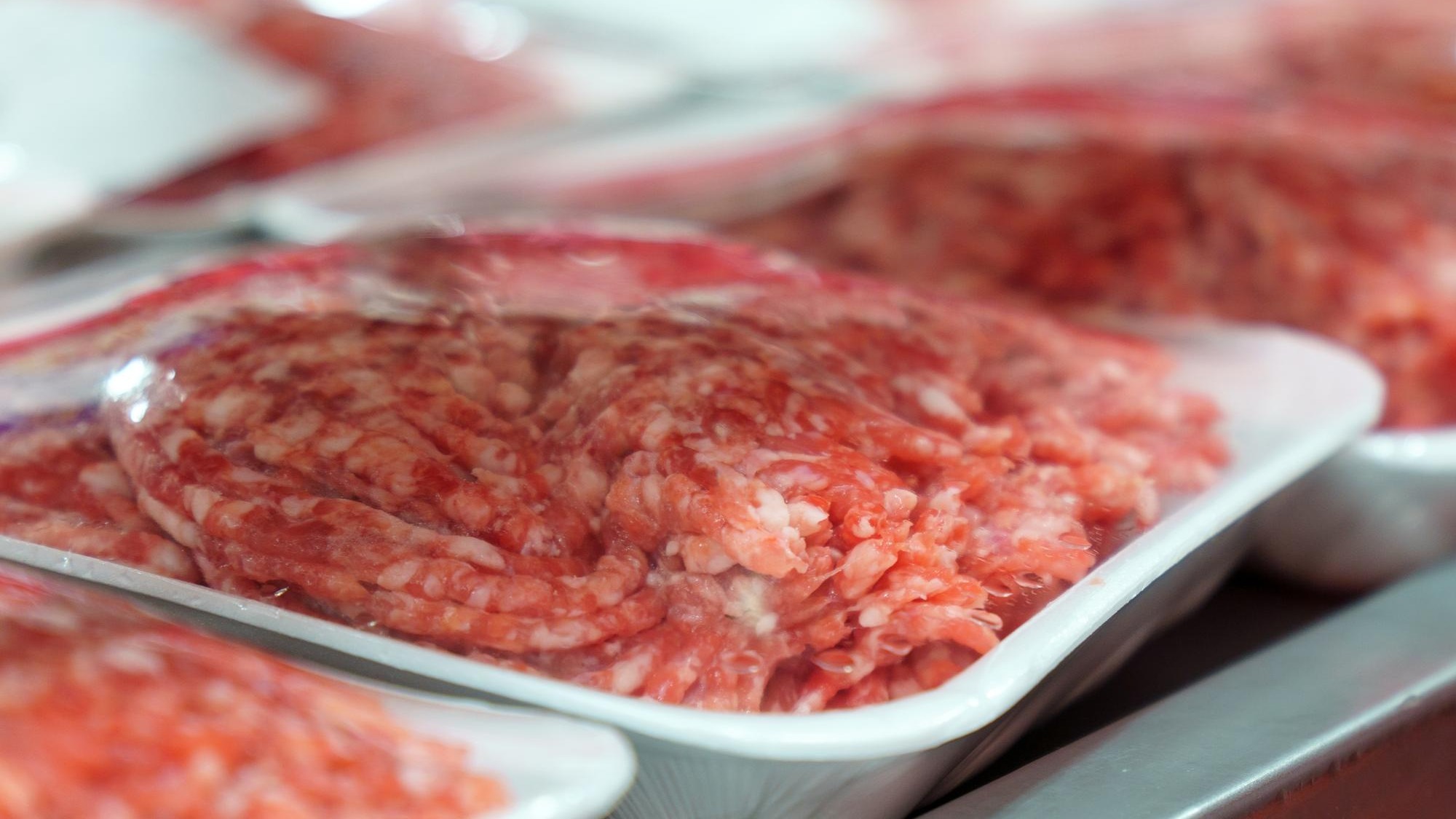 Raw fresh beef meat on the shelves of a hypermarket Buying raw meat
