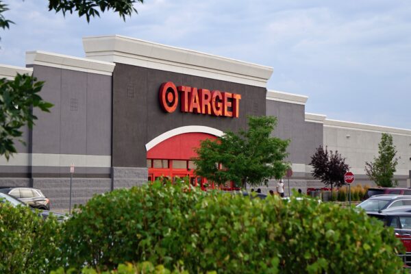 View of a Target store with parking lot, featuring signage and greenery.