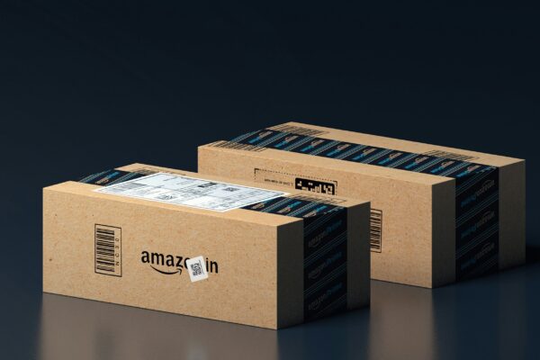 two boxes of amazon are stacked on top of each other