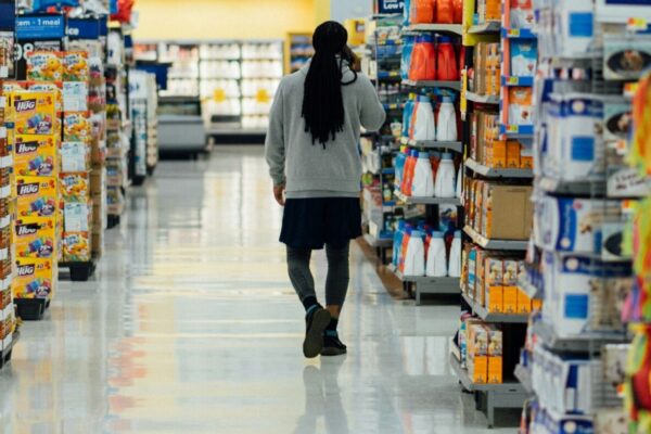 person standing between shelvings