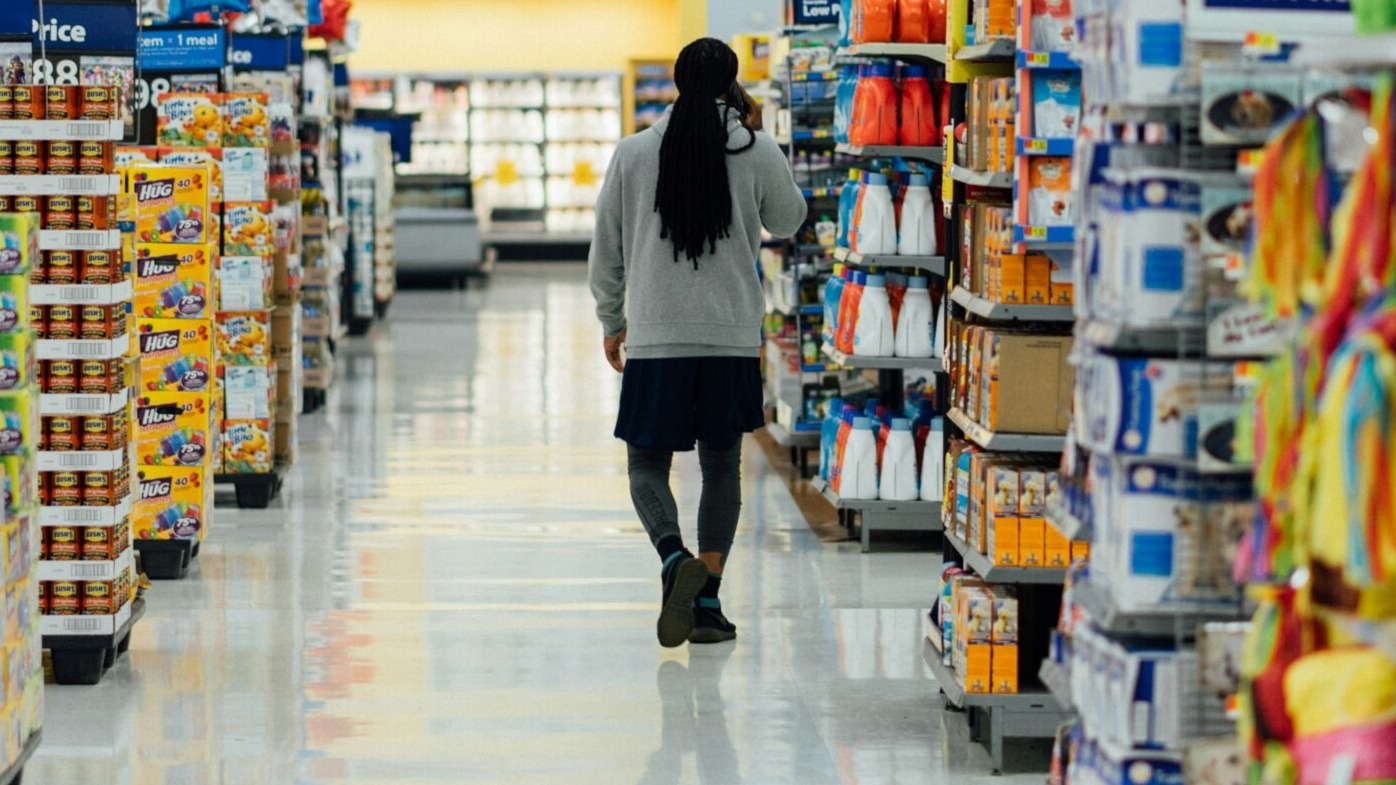 person standing between shelvings