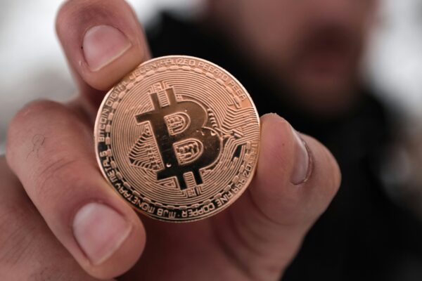 a person holding a coin