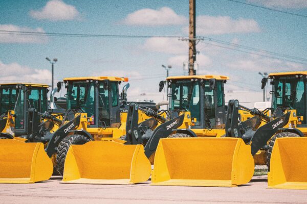 yellow and black heavy equipment on snow covered ground during daytime